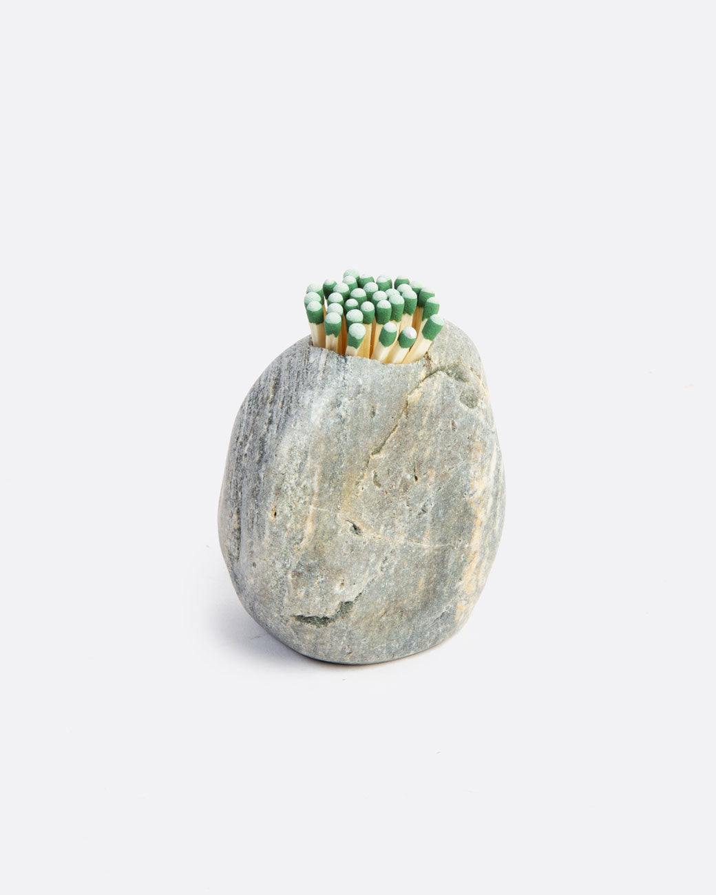 A stone match striker that is light grey with matches in a hole on the top. Shown from the front.