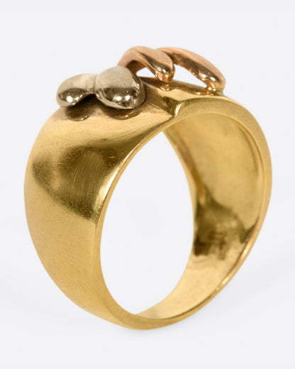 A wide, dimpled yellow gold band with white and rose gold teardrop accents. Shown from the side standing up.